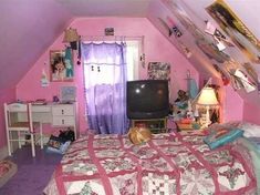 a bed room with a neatly made bed and a tv on top of the dresser