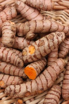 some very pretty looking carrots in a wicker basket