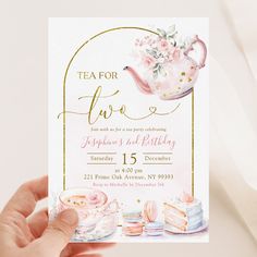 a hand holding up a tea party card