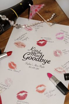 lipstick is laying on top of a sheet of paper with the words kiss me, miss goodbye written on it