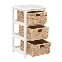 three white shelves with wicker baskets on each shelf and two brown bins in the bottom