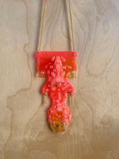 One of a kind hot pink pendant sculpted from recycled plastic, acrylic, resin and glue on a gold-plated chain.  All necklaces come in pre-made lengths designed to fit most people, but if you have a specific length in mind, please message me and I'm happy to accommodate! Pink Necklace With Large Pendant, Unique Pink Necklace With Large Pendant, Pink Resin Party Necklaces, Pink Plastic Party Necklace, Pink Plastic Necklaces As Gifts, Pink Plastic Necklace For Gift, Pink Plastic Necklace Gift, Handmade Pink Plastic Necklace, Pink Resin Pendant Necklace