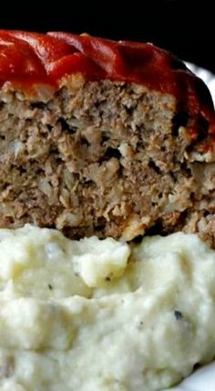 meatloaf with mashed potatoes and ketchup on top