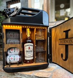 an open case filled with liquor bottles on top of a table