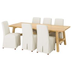 a wooden table with white chairs around it