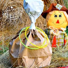 two scarecrows made out of paper bags