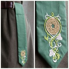 two different views of a green tie with embroidered designs on the side and in front