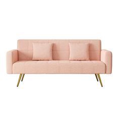 a pink couch with three pillows on it