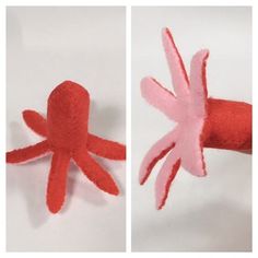 an octopus made out of felt sitting on top of a piece of paper next to another object