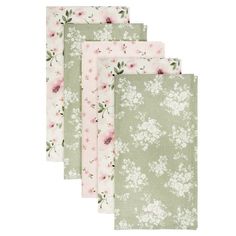 four napkins with pink and green flowers on them