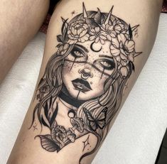 a woman's face with flowers and butterflies on her thigh, as if she is wearing a sunflower crown