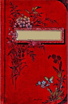 a red book with flowers and butterflies on it