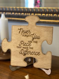 a wooden puzzle with the words never forget you are the piece that made the difference