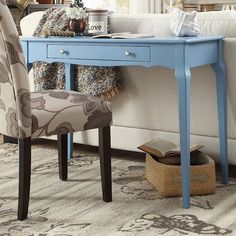 a blue desk with a chair next to it