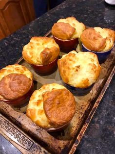 there are many small pies in the pan on the kitchen counter ready to be eaten