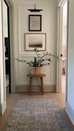 Neutral hallway runners | picture frame molding | hallway decor Transitional Hallway Decor, Molding On Hallway Walls, Split Level Entry Way Decor, End Of A Hallway Decor, End Of Narrow Hallway Ideas, Hallway End Decor, Split Level Hallway, Vintage Hallway Decor, Picture Frame Molding Entryway