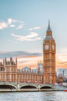 the big ben clock tower towering over the city of london, england at sunset or dawn