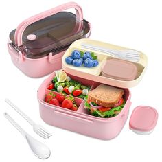 two pink lunch boxes filled with food and utensils