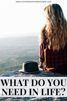 a woman sitting on top of a rock with the words what do you need in life?