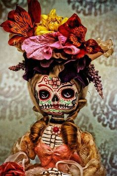 an image of a doll with flowers on it's head and hair in the shape of a skeleton