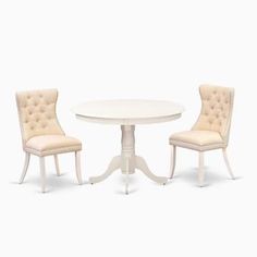 a white table and two chairs sitting next to each other