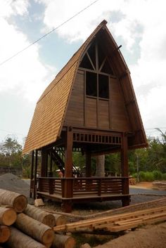 a wooden structure with a roof made of wood