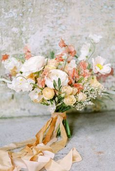 a bouquet of flowers sitting on the ground