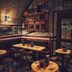 an empty restaurant with wooden tables and chairs