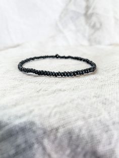 Tiny 10/0 matte opaque black seed beads bring together a stand out dainty vibe when added to a personalize stack.  This is a stretchy style bracelet + the standard length is 7 inches. If you need a different size specification please attach a personalization. Black Seed, May 2023, Bracelet Stack, Fashion Bracelets, Arm Band, Seed Beads, Matte Black, Jewelry Bracelets, Beaded Bracelets