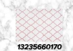 a white and pink tile with the words 12335670 on it