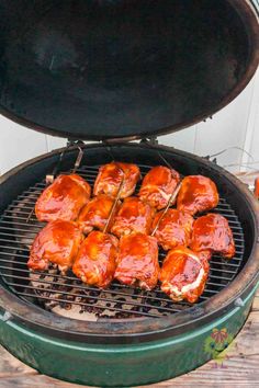 chicken wings are being cooked on the grill