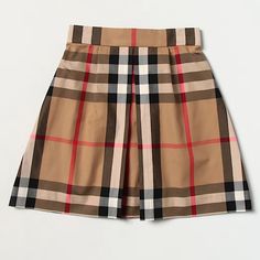 This Lightweight Skirt Is Decorated With The British Label's Distinctive Oversized Check In Their Signature Beige, Black And Red Colour Palette. A Stylish Inverted Front Pleat Gives The Skirt A Flattering, Feminine Silhouette. The Waist Is Softly Elasticated Around The Back For A Comfortable Fit. Oversized Check Knee Length Soft, Lightweight Weave Pull-On Style 100% Cotton Machine Wash (30*C) Bin: Kk Check Print Skirt, Mini Skirts Fashion, Burberry Shorts, Girls Dancewear, Kids Plaid, Lightweight Skirt, Red Colour Palette, Check Skirt, Chiffon Wrap