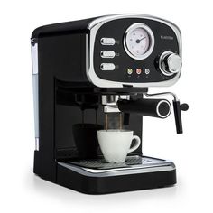 an espresso machine with a coffee cup on the front and bottom, is shown