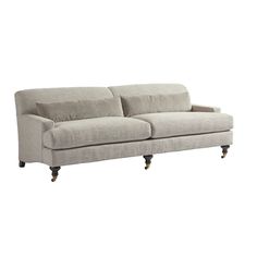 a gray couch sitting on top of a white floor