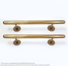 two antique brass door handles on white background