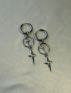 "These Venus symbol-inspired earrings feature the prettiest star charms - they add a celestial touch to any look These earrings are hypoallergenic, as well as lead and nickel-free. For optimal care, be sure to keep away from moisture! Hoop width: 12 mm Tip: all my earrings come in pairs, meaning that \"1 quantity\" equals one pair. ;)" Cross Grunge, Korean Y2k, Goth Earrings, Quilled Creations, Punk Earrings, Y2k Jewelry, Star Cross, Hollow Heart, Funky Jewelry