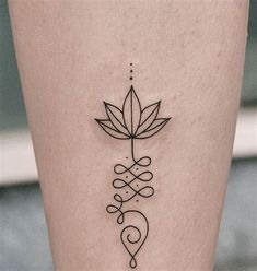 a woman's leg with a tattoo design on the lower part of her leg