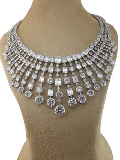 Adastra has a wide variety of cubic zirconia diamond necklace for women to choose from. This gorgeous CZ diamond necklace is in 925 sterling silver. SKU: AANC_015 Base Metal: Hypoallergenic 925 Sterling Silver (No Nickel, No Lead, No Cadmium) Metal Plating: Rhodium Stone 1: AAAAA Grade Cubic Zirconia Diamond (Very shiny - does not fade) Duty & Taxes are the buyer's responsibility. We can custom make any jewelry in 925 Sterling Silver / 18K Solid Gold / 14K Solid Gold / 10K Solid Gold. Click Mess Luxury Dazzling Halo Design Necklace, Bridal Diamond Necklace With 17 Jewels, Luxury Round Bridal Necklace With Sparkling Stones, Luxury Brilliant Cut Necklace For Celebration, Dazzling Hand Set Sterling Silver Necklaces, Luxury Bridal Necklace With Sparkling Stones For Celebration, Luxury Bridal Necklace In Sterling Silver, Luxury Hallmarked Cubic Zirconia Bridal Necklace, Luxury Custom Silver Necklace With 17 Jewels