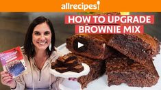 a woman holding a box of brownie mix next to a pile of brownies