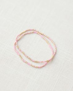 - 2mm gold filled ball beads mixed with color glass seed beads (one pink and gold bracelet) - 6.5 inches Pink Beaded Bracelets, Surf Jewelry, Preppy Jewelry, Sister Jewelry, Jewelry Essentials, Stacked Jewelry, Jewelry Lookbook, Jewelry Outfit, Glass Seed Beads