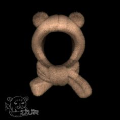 a teddy bear with a scarf around it's neck is shown in the dark