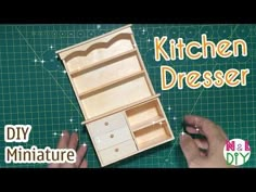 someone is making a miniature kitchen dresser out of wood