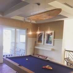 a pool table in the middle of a room