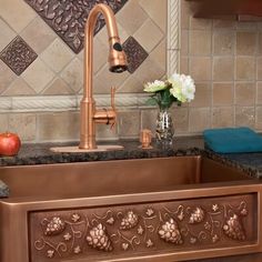 a kitchen sink with an ornate design on the front and side, next to a counter top