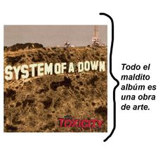 a sign that says system of a down on top of a hill