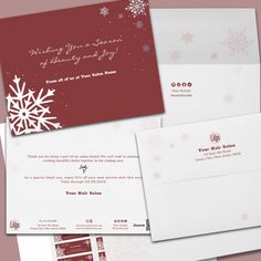 two envelopes with snowflakes on them, one in red and the other in white