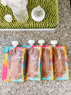 four bags of food sitting on top of a counter