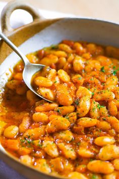 a large pot filled with pasta and sauce