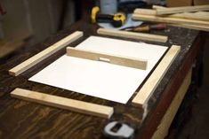 the workbench is being made with plywood and woodworking tools on it