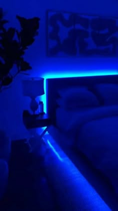 a bed with blue lights on it in a room